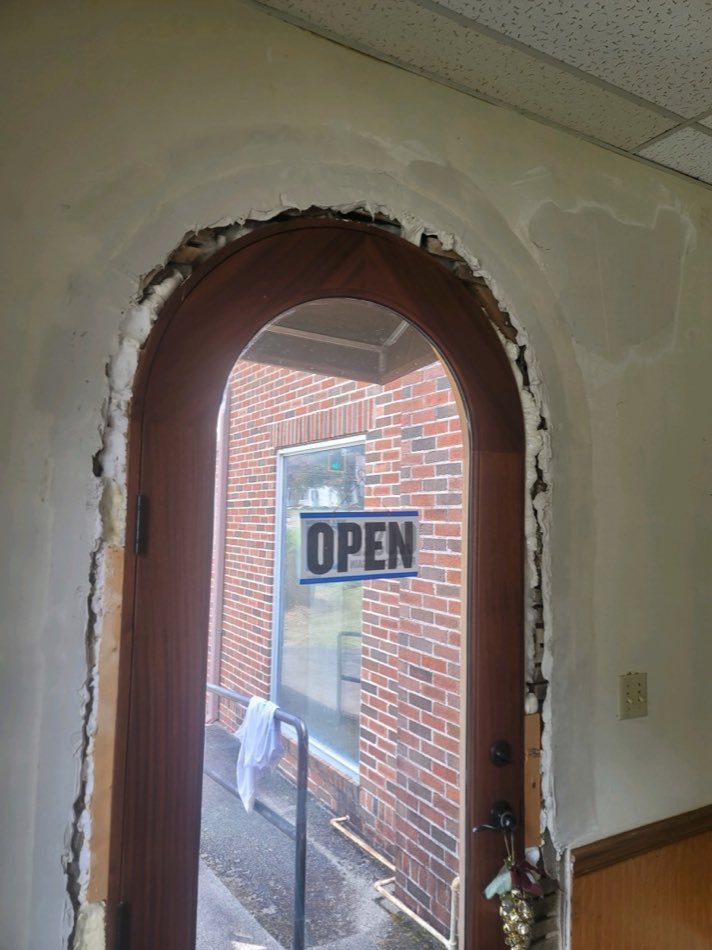 Structural doorway repair in progress during a property restoration