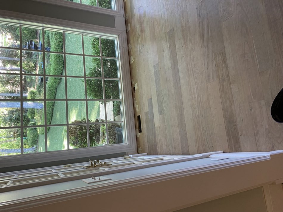 Interior rebuild with new flooring during an insurance restoration