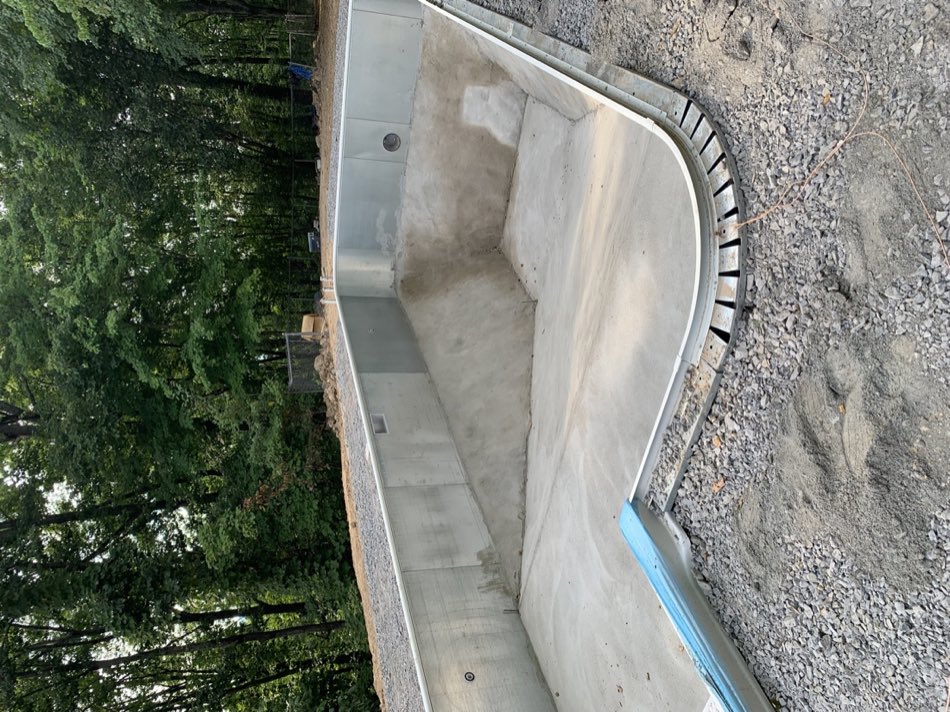 Structural concrete and hardscape work for a backyard pool and entertainment area