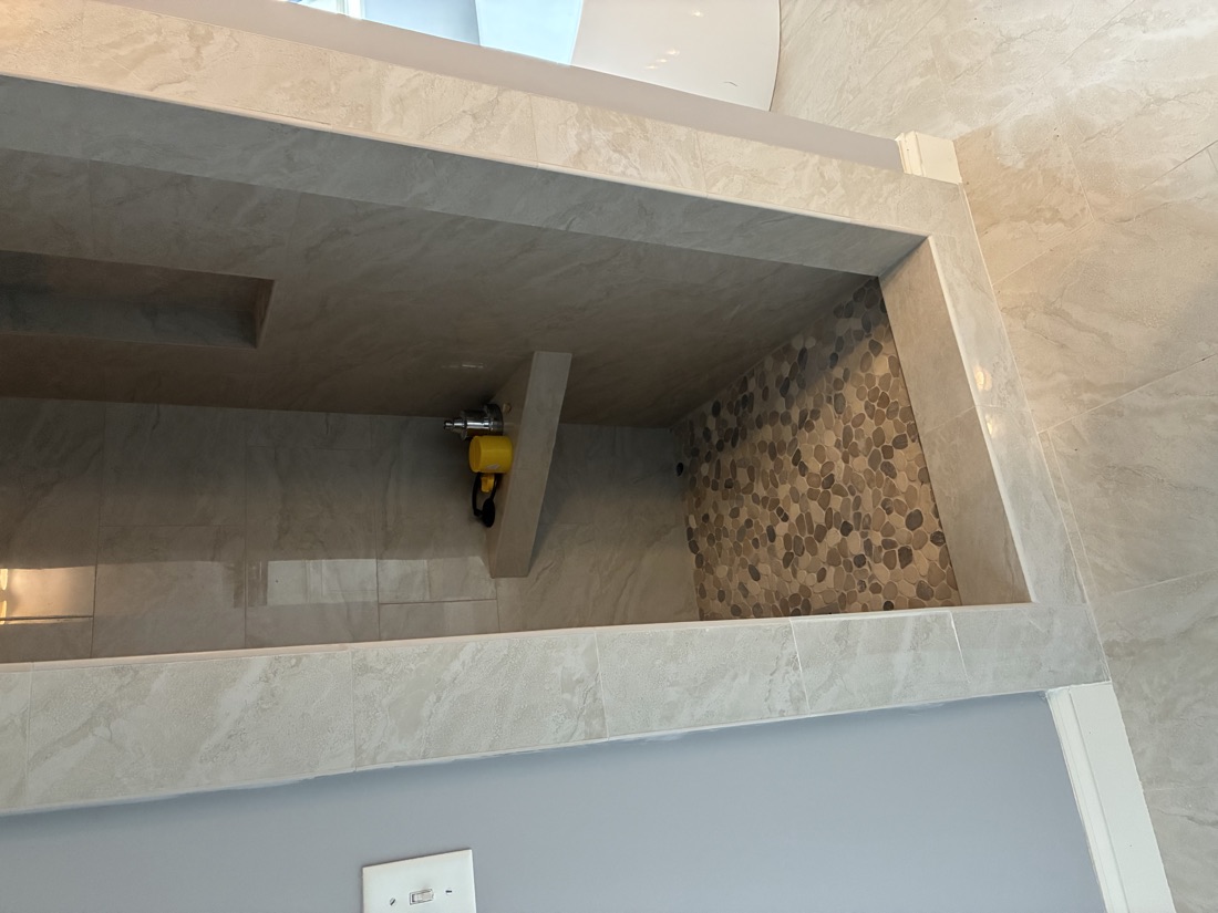 Custom tiled walk-in shower built during a whole-home remodel