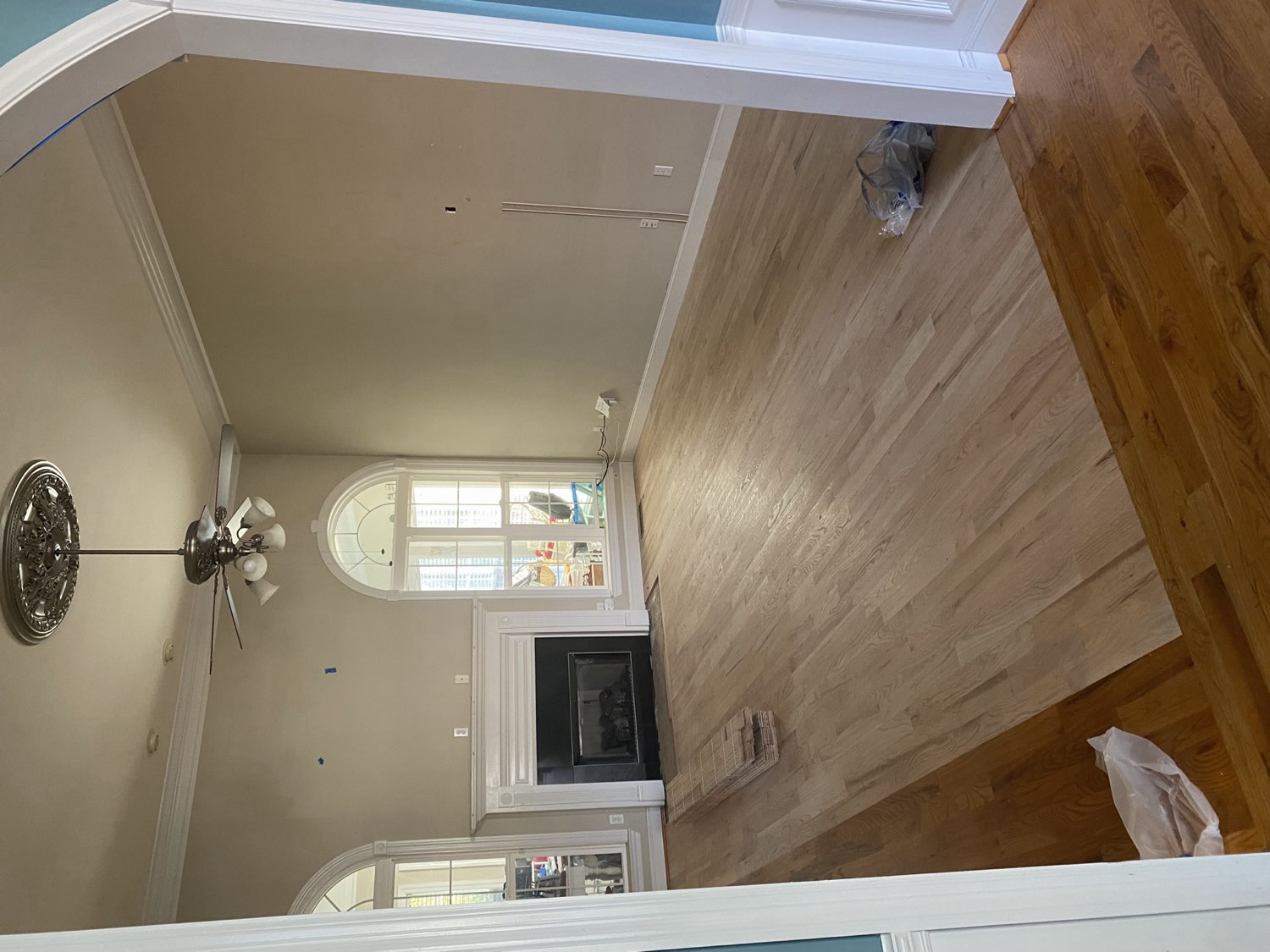 Finished living room with hardwood floors and fireplace built by Top Rock Solutions in Chattanooga
